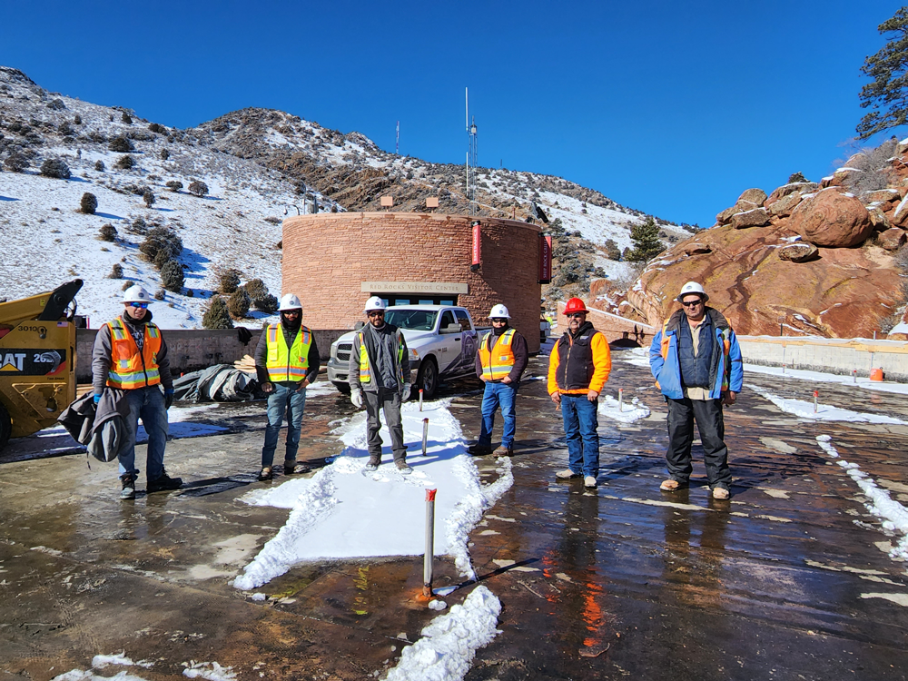 Group of 6 Brown Brothers contractors standing in front of Red Rocks Visitor center worksite